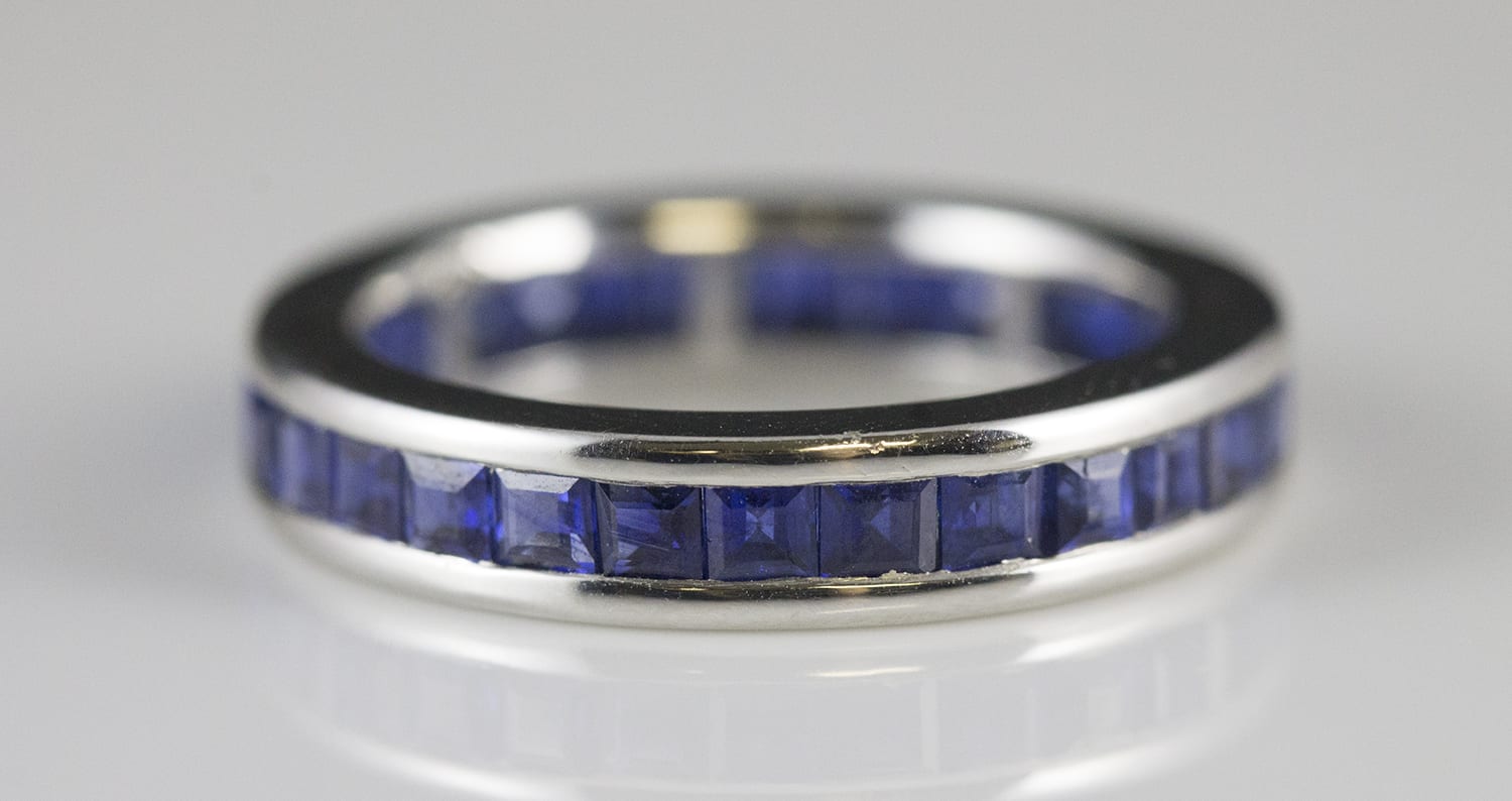 18k White Gold Eternity Band w/ 29 Medium Dark Blue Square Step Cut Channel  Set Blue Sapphires - D377